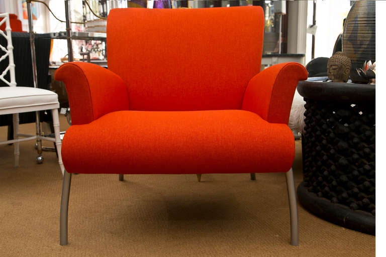 Generously proportioned modern armchair custom upholstered in a richly textured orange micro-fiber. Probable Ligne Roset. Condition excellent.
