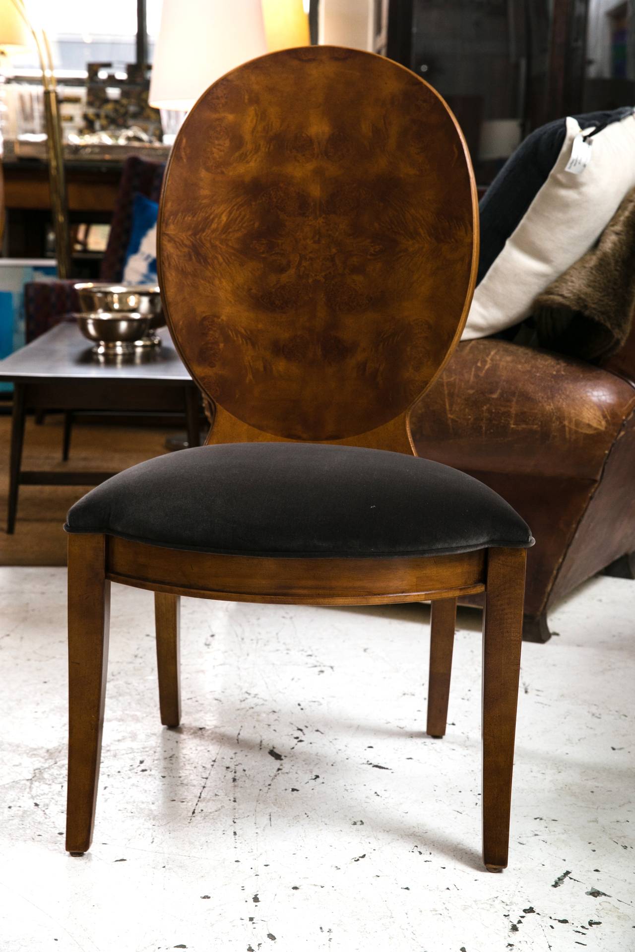 Stunning set of six burl wood chairs with a molded elliptical backrest. Ample size and newly reupholstered with high quality charcoal velvet with matching piping. Built with an incredibly solid structure yet comfortable.