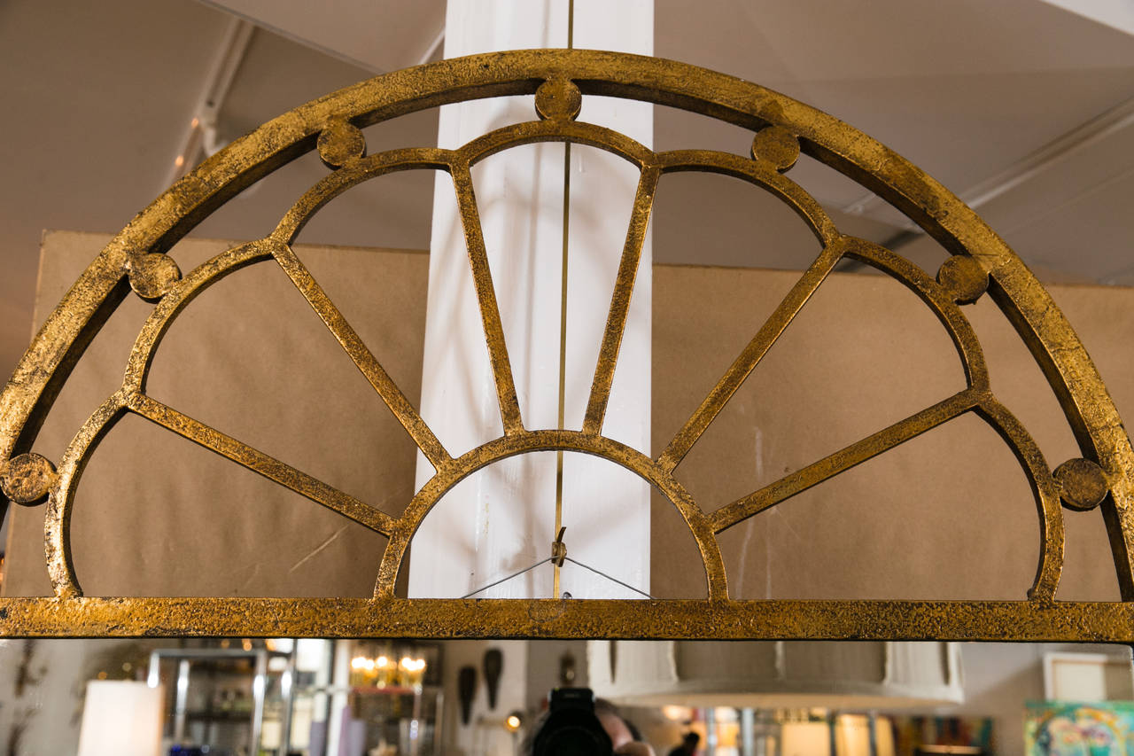 North American Gilt Encrusted Iron Arch Mirror