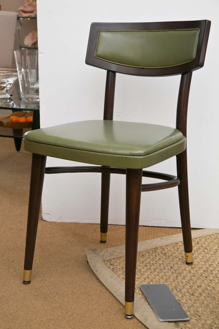 Very well made and all original set of Dark Chocolate finish side chairs manufactured mid-century by Thonet. Brass accent leg and original Olive leather type vinyl.