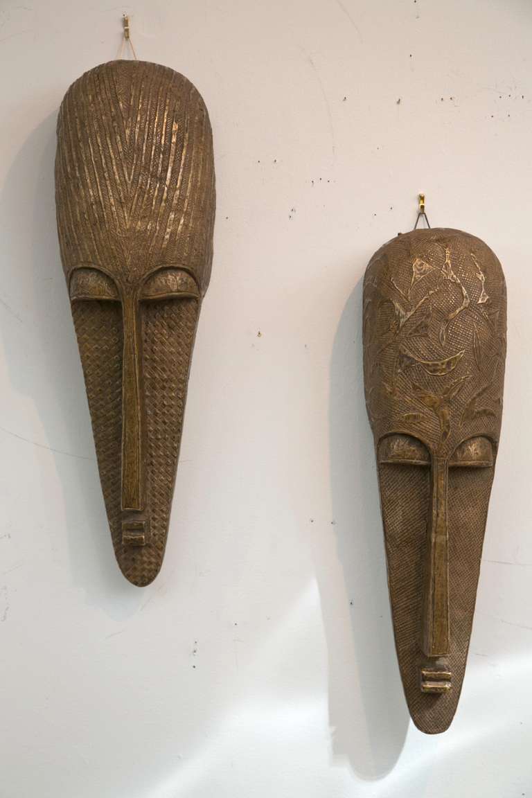 Stunning compatible pair of traditionally made brass sheathed masks. Mali region of Africa, Burkina Faso Tribe. Probable date of manufacture 1960's. Excellent condition and age patina.