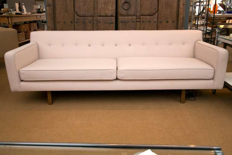 Iconic Mid 1960's bracket sofa designed by Edward Wormley and made by Dunbar Furniture. All original condition. We are prepared to custom upholster this piece in C.O.M. Please inquire regarding fabric requirements.