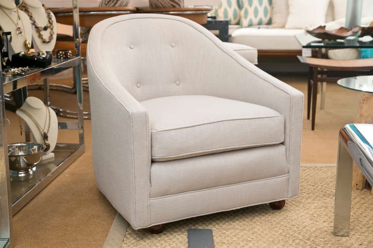 Diminutive and very comfortable 1960's  club chair with casters custom upholstered in a quality linen.