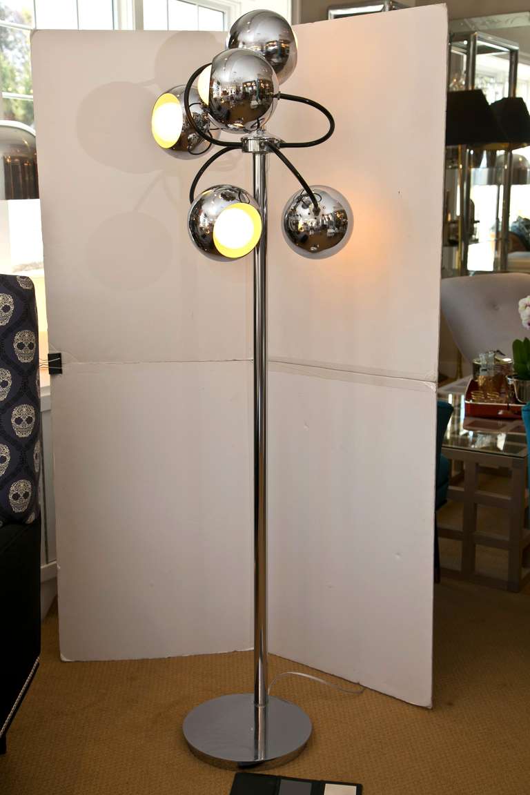 Period 1960's multi head chrome floorlamp in excellent condition. Very good workmanship and outstanding prescense, the chrome globes circle the base on black tentacle like extensions. Very much in the manner of Robert Sonneman .Weighted base.