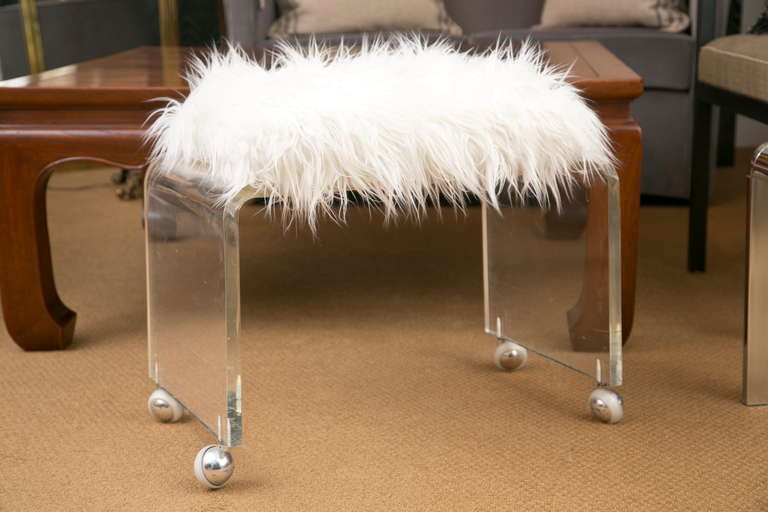 1970's thick quality castored Lucite bench custom upholstered in a quality Faux-Mongolian Lamb's Wool treatment.