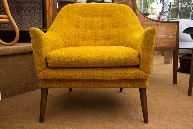 An all original Danish club chair dating from the 1960's. Overall condition is very good with tufted back and walnut legs.  

