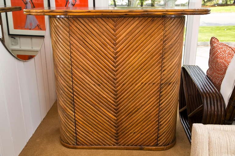 Vintage 1950's bent rattan Tiki bar with back shelf and storage. Interesting top made from resin imbedded pennies. Very well made and  alot of fun. Aloha!