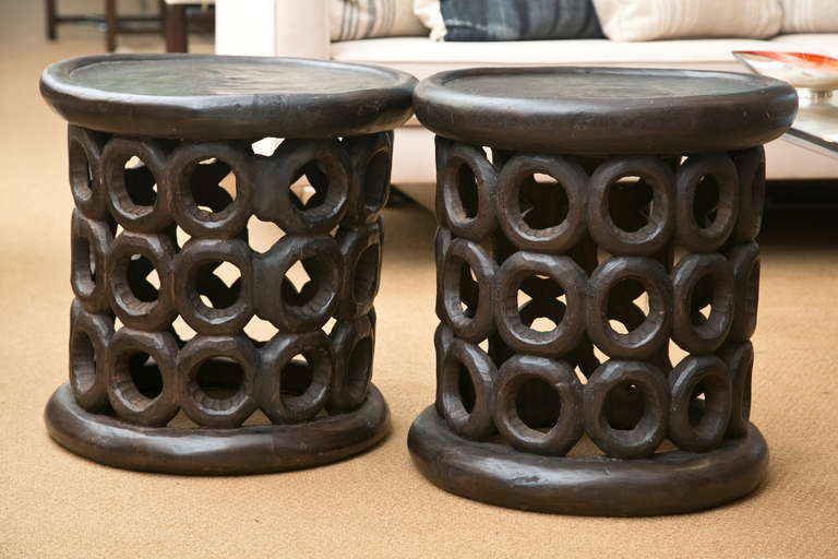 Responsibly harvested West African Cameroon stool/table pair. Single trunk carvings done in a traditional tribal pattern. The wood is harvested from coffee plantations.