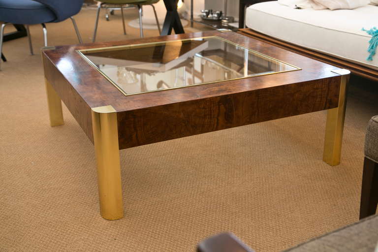 1970's burl with brass accent low table in the manner of Milo Baughman. Perfect proportions with inset original glass.