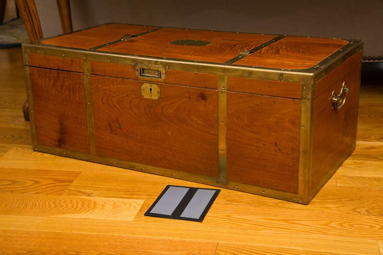 All original antique English figured mahogany campaign trunk. Inset lift handle and blank brass owners plate on top.