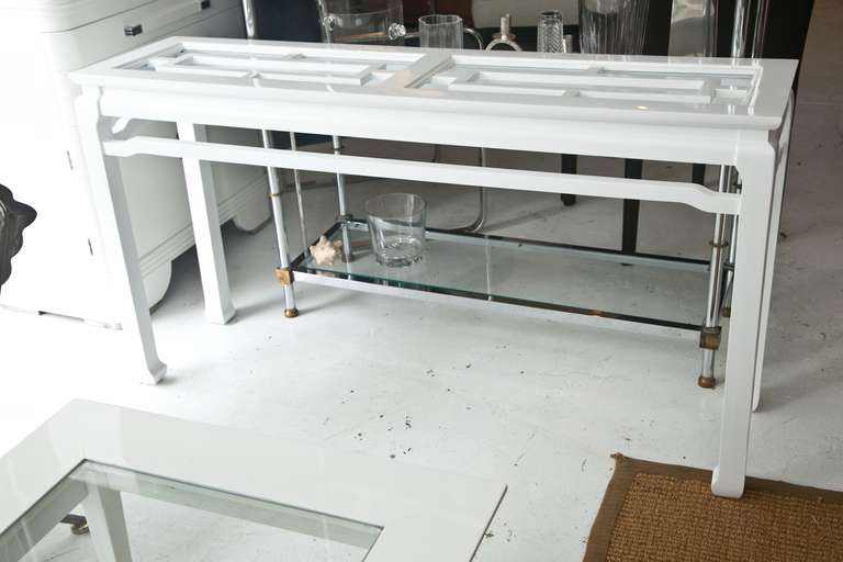 Very fine 1960's open-work, Asian Modern style console table with excellent proportions. Two original beveled glass top inserts. Custom Lacquered.