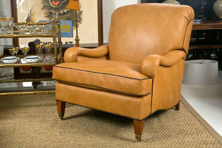Incredibly comfortable and well made custom leather club chairs. Made by Edward Ferrell, these chairs have the ability to recline, and the workmanship is masterful.  We have 1 chairs available.