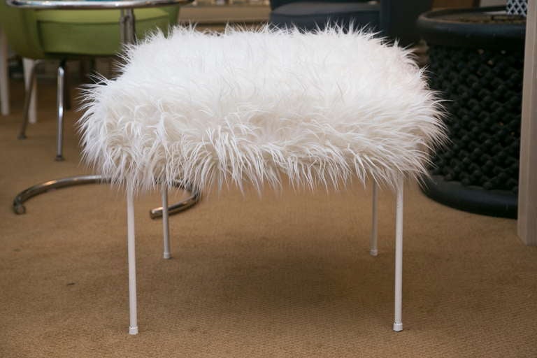 Iconic 1950's ottoman designed by Paul McCobb. Upholstered in Faux-Mongolian Lamb.