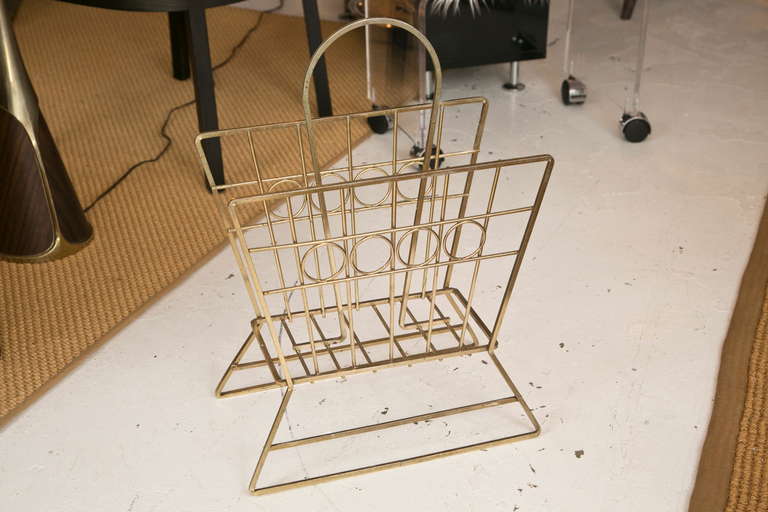 A 1950's-1960's Brass finish magazine rack with great over sized proportions and good weight.