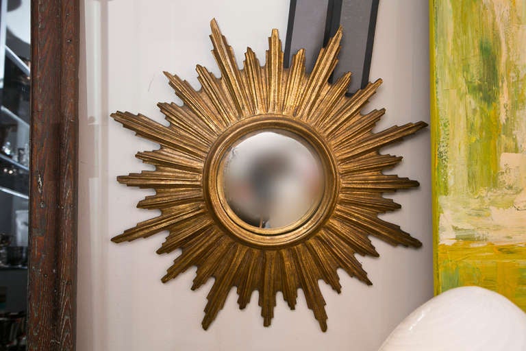 Decorative gilt composite French style sunburst mirror with convex glass.Please call the shop (203)-349-5859 or press 