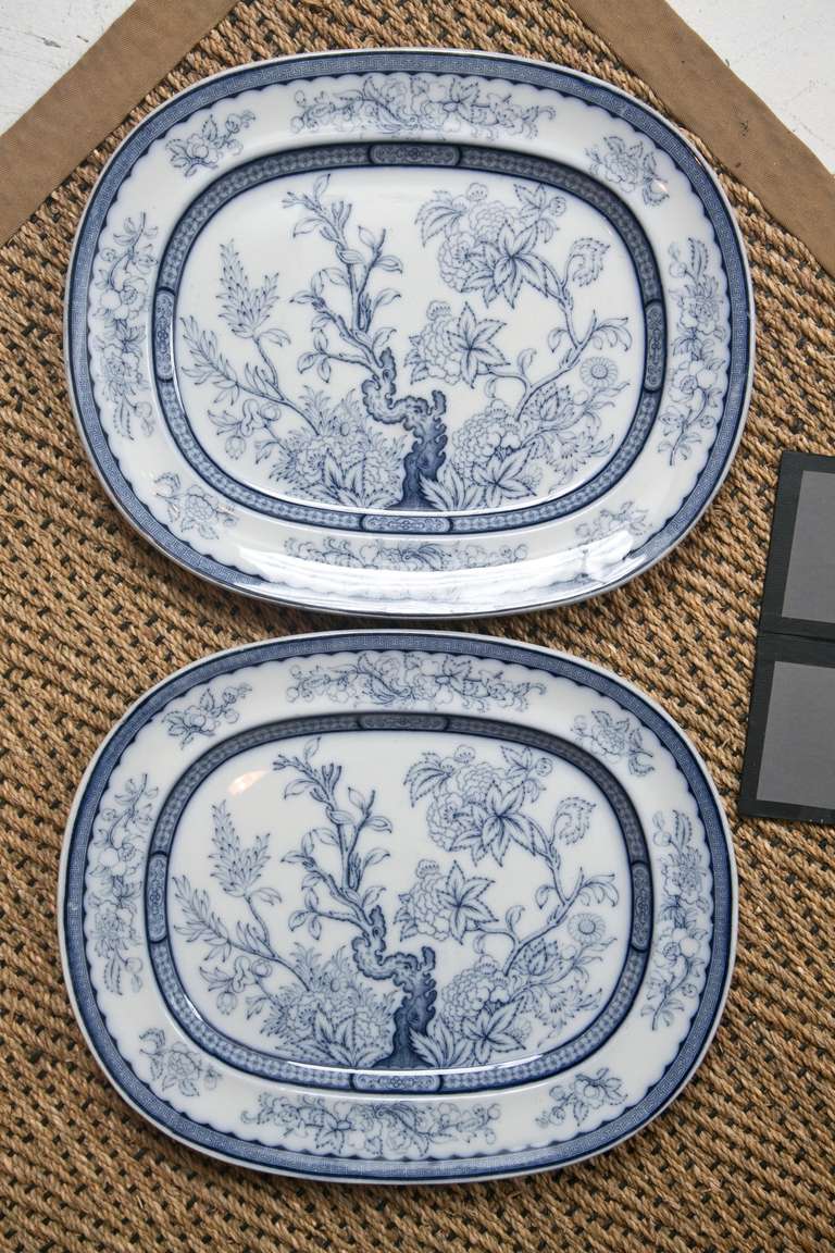 A matched pair of English 19th century blue and white stoneware platters marked 