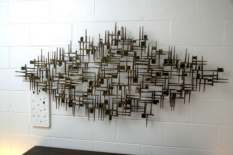 Outstanding gilt-metal wall sculpture of a monumental size by William Bowie. Classic modernist design.