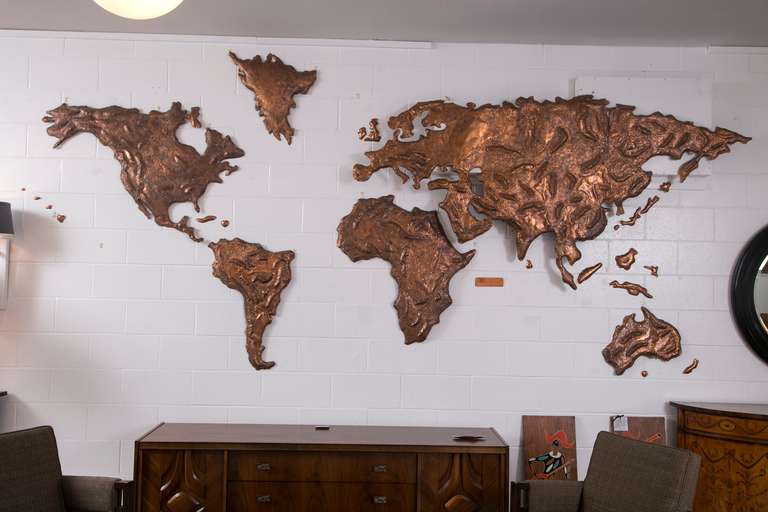 Commissioned by Sabena Airlines Belgium. This unique copper repousse world map was the backdrop for Sabena's check in counter at JFK Airport, New York, in the 1970's. The commission was given to the Chilean metal worker and artist Patricio Caces.