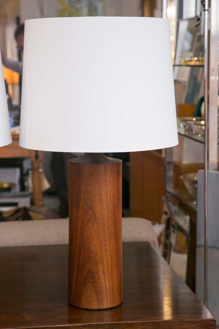 An outstanding pair of solid teak lamps dating to the early 1960s. Excellent condition.
