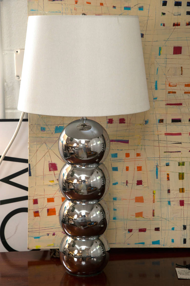 A fine pair of the classic 1960s chrome ball lamps designed and manufactured by George Kovacs. Excellent condition, the pair has been re-fitted and re-wired. Custom shades.