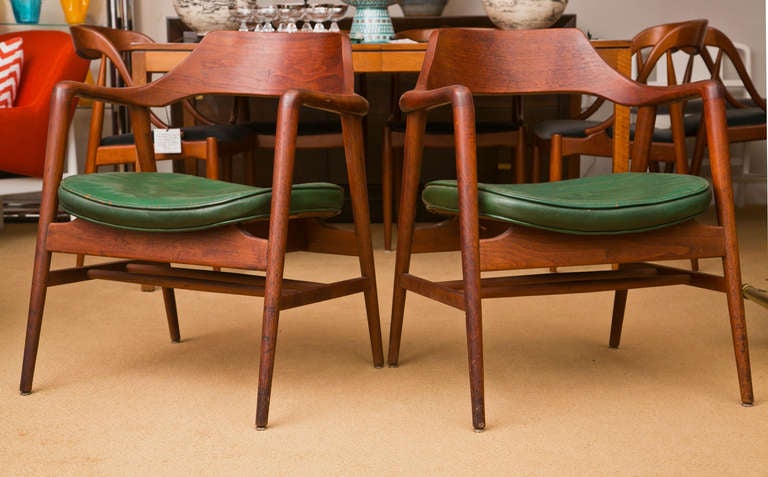 An original pair of solid teak Gunlocke chairs.  As found condition.  This pair is c. early 1960's. They have it all, style strength and great pure mid-century design.

For over a century, Gunlocke has manufactured great furniture for large and