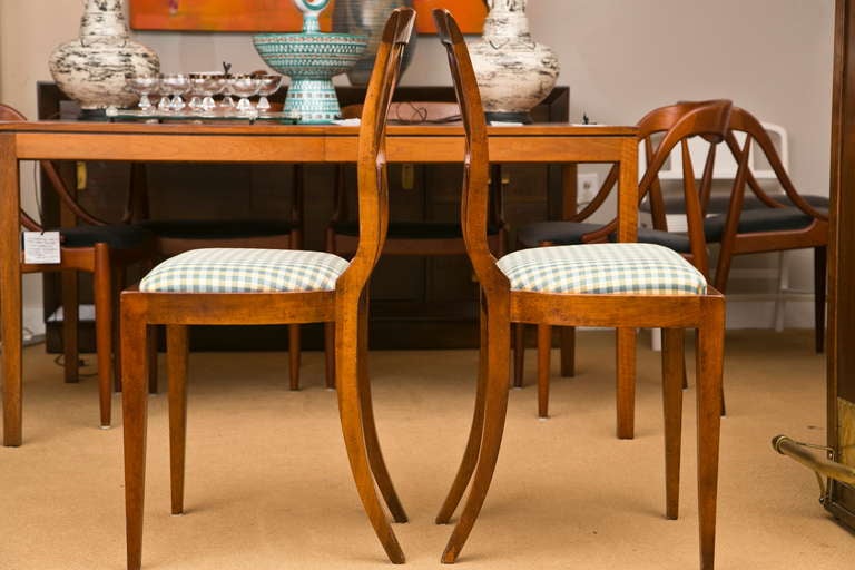 A finely proportioned  pair of lightly distressed Provincial French side chairs. Lyre form back support and quality chair check fabric.