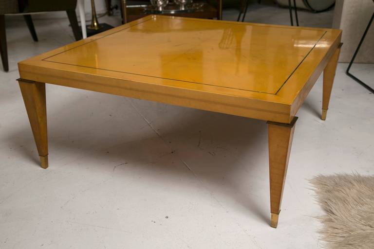 A very finely made Italian lemon wood table designed by Leonard Haber for the Italian Design firm, Albano. Excellent, delicate proportions with brass string inlay and tapered leg with brass cap foot.