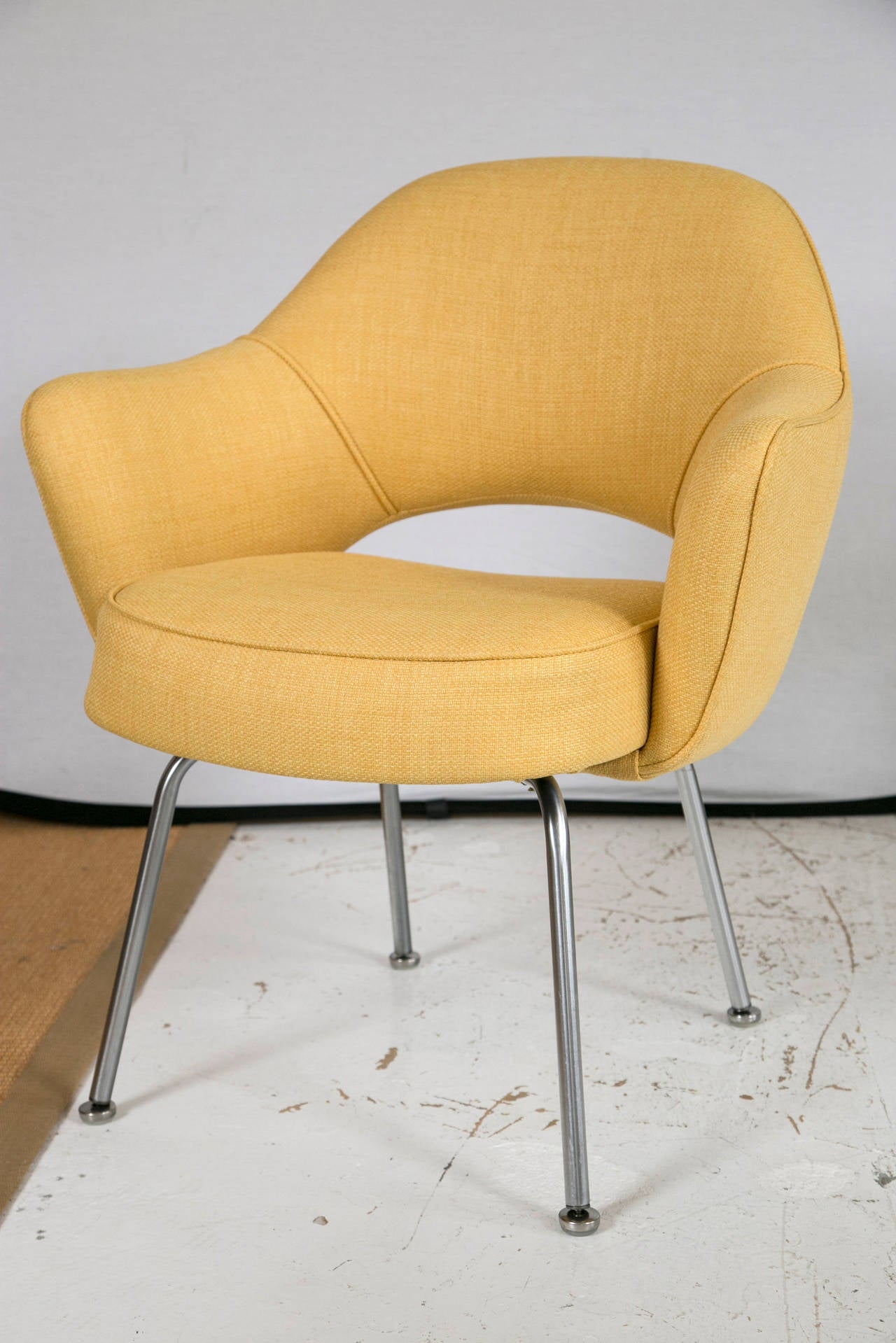 The Mid-Century classic Eero Saarinen Executive Armchair. Manufactured by Knoll Furniture and custom upholstered in a Canary Yellow microfiber. Priced as a single piece, however custom set amounts are available. Please contact us and we would be