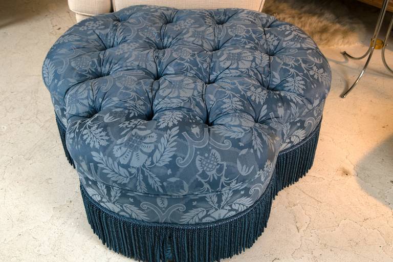A large and impressive trefoil form ottoman custom upholstered in a rich, contrasting damask. Very well made, and suitable as cocktail or tray table. This ottoman may be incorporated into a various assortment of interior styles: English, Bohemian,