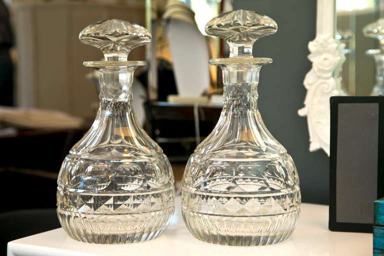 Outstanding pair of antique Georgian style cut crystal decanters. Excellent optic cut, weight and clarity.