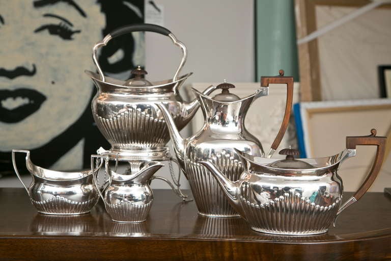 Beautiful 4 piece Georgian Style Sterling Silver set circa 1914 by Walker and Hall, joined with a circa 1920 sterling tea urn on stand.All in near mint condition.