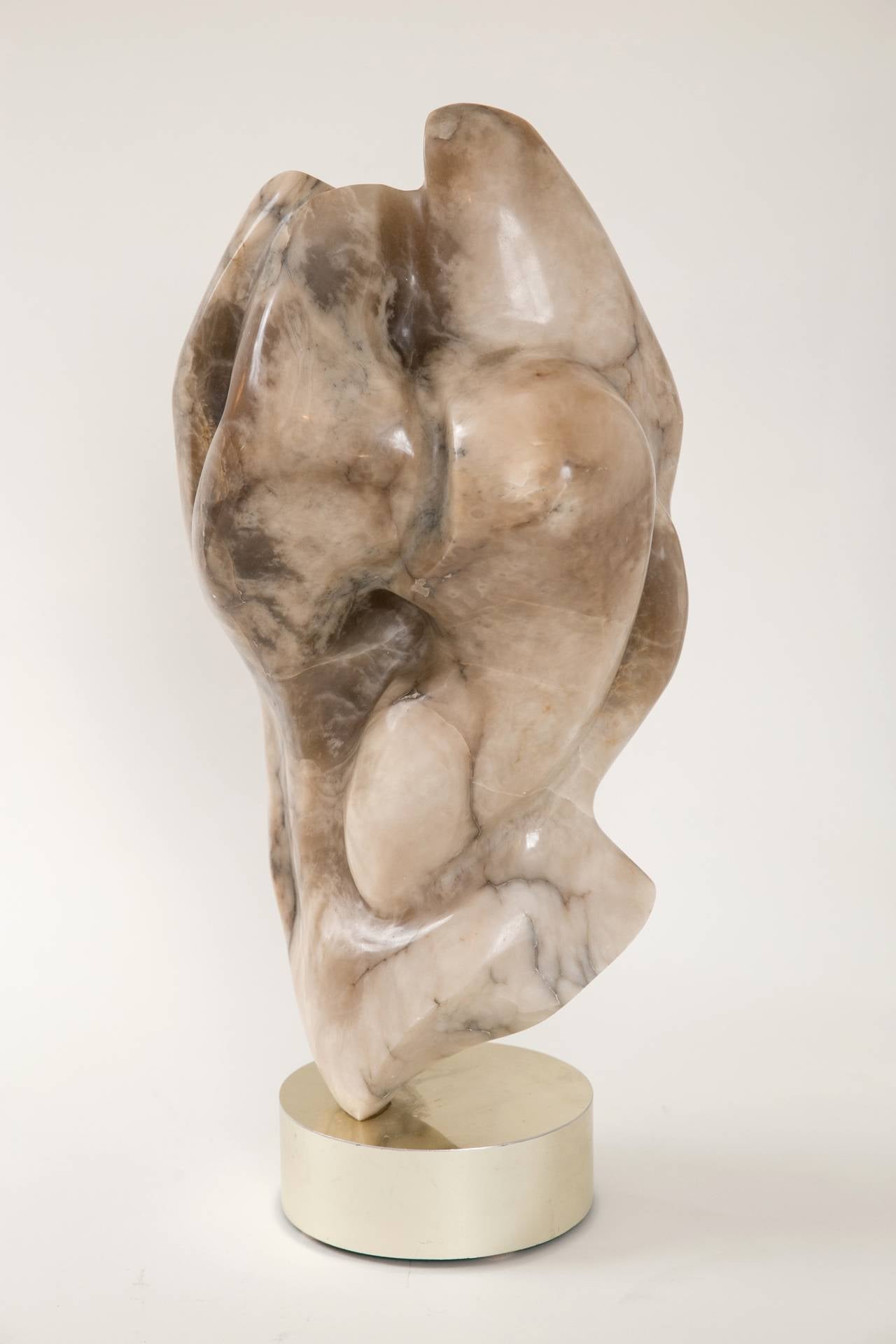 Very well made 1960's abstract stone sculpture on custom brass base. Although the piece is unsigned, the influences of Abstract Expressionism, Jean Arp, and Henry Moore are quite evident. Excellent condition.