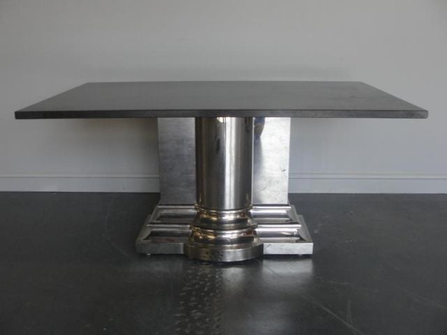 Classic Column Table designed by Stanley Jay Friedman for Brueton. The sculpted column base supports a stone top with a 1