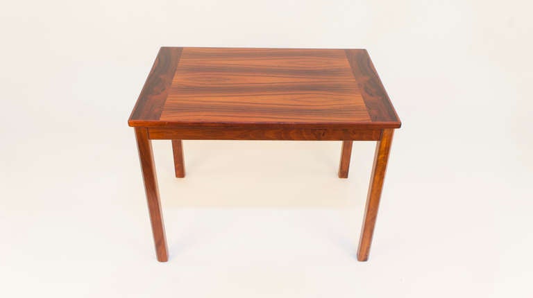 Nearly identical in size to the previous entry, yet unique in the cabinetmaker's use of lighter, more even-grained wood veneers, these tables look like fraternal, rather than identical twins. 

Brazilian designers of the 1950s and 1960s introduced