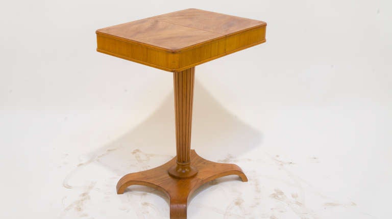 A sleek little pedestal table which slides open to reveal a series of small compartments designed for storage of spools, yarns, knitting needles etc. Creative uses may include display of small collectables or jewelry storage.

Crafted of solid