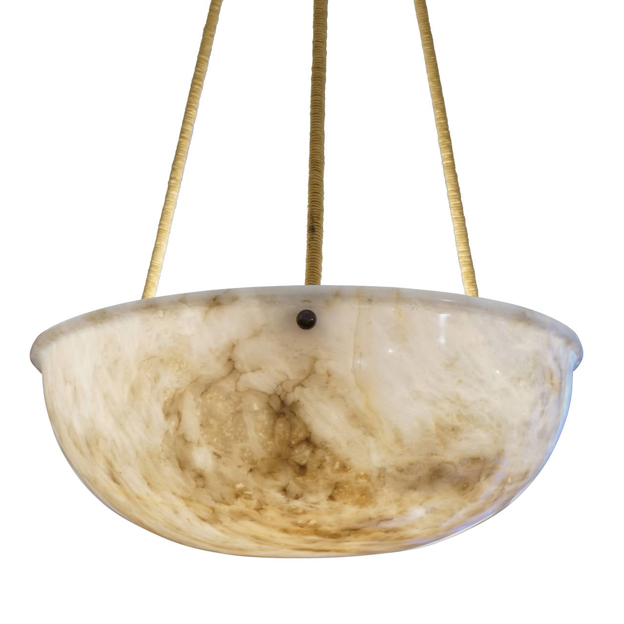 A Classic shape with a single rimmed upper edge, this light fixture was carved from an unusual and lovely piece of ivory alabaster with a warm centre and a sprinkling of charcoal mineral veining, providing plenty of light using three 40 watt