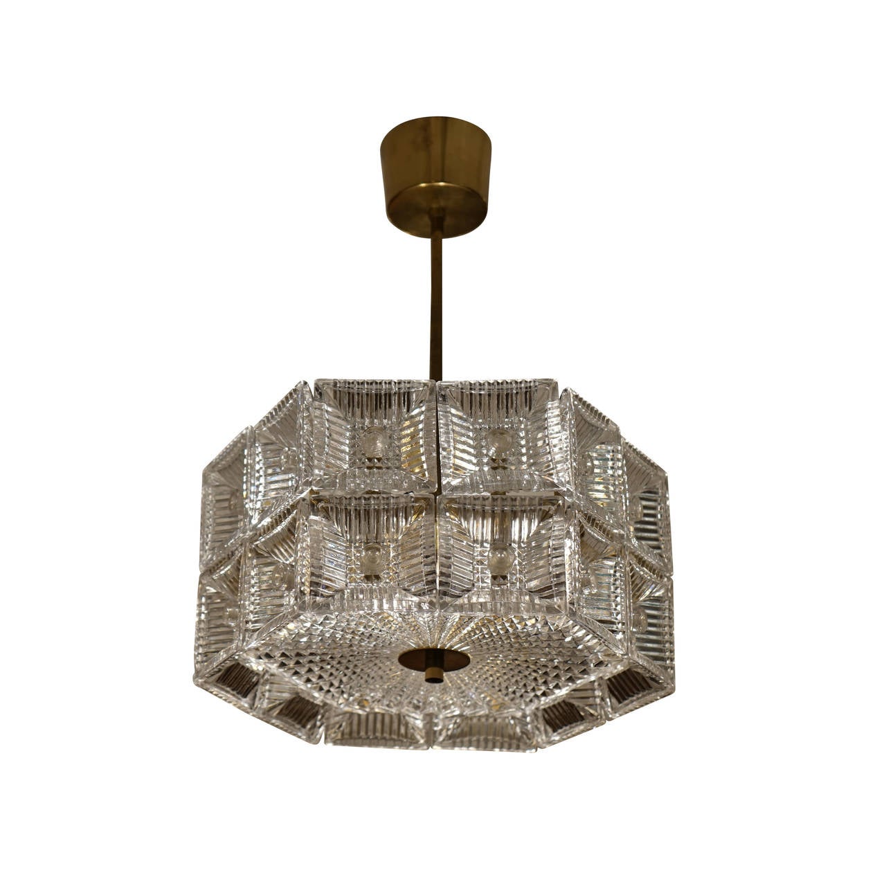 Reflective like a disco-ball, this hexagonal fixture casts light in all directions due to the 24 inverted glass squares and a sunburst patterned base.  Nearly identical to  another fixture posted immediately before this in our inventory, the sizes