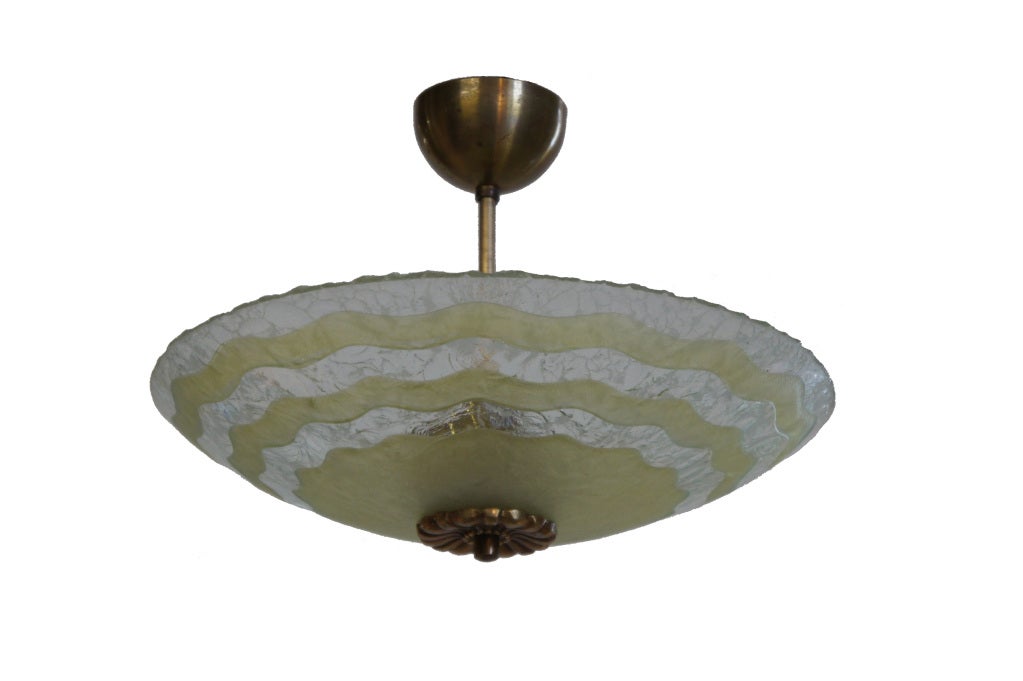 Moulded and etched, with wavy, hand-carved celadon-toned concentric circles.