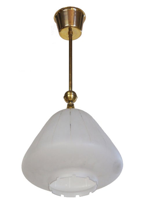 A petite down facing fixture of frosted glass, etched with clear vertical lines and a stylized dental motif edge.