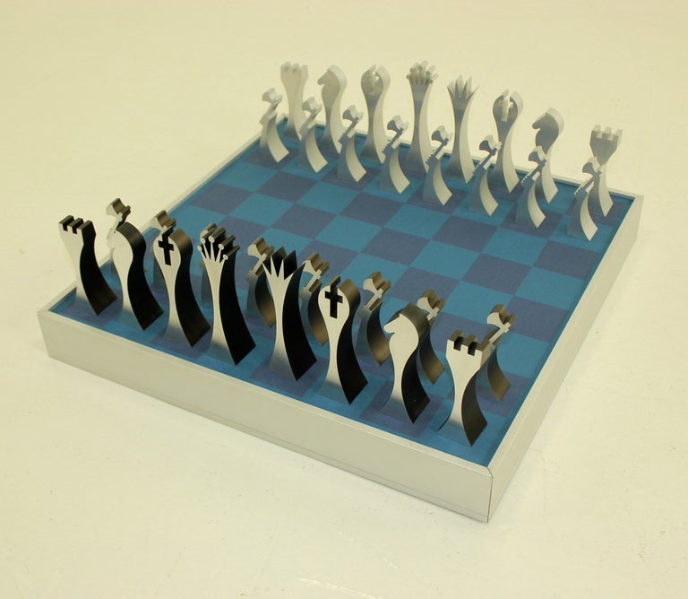 Extraordinary chess set designed by Scott Wolfe in 1972.
Columbia Aluminum, maker.
Aluminum chess pieces and box. Lucite Cover.