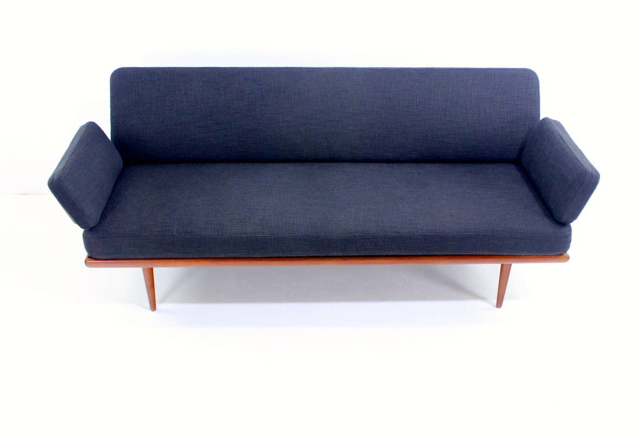 Danish modern sofa or daybed designed by Peter Hvidt. 
France & Son, maker.
Rich teak with polished chrome hardware.
Supreme comfort with new cushions composed of jute, burlap and foam around original metal inner springs.
Newly upholstered in