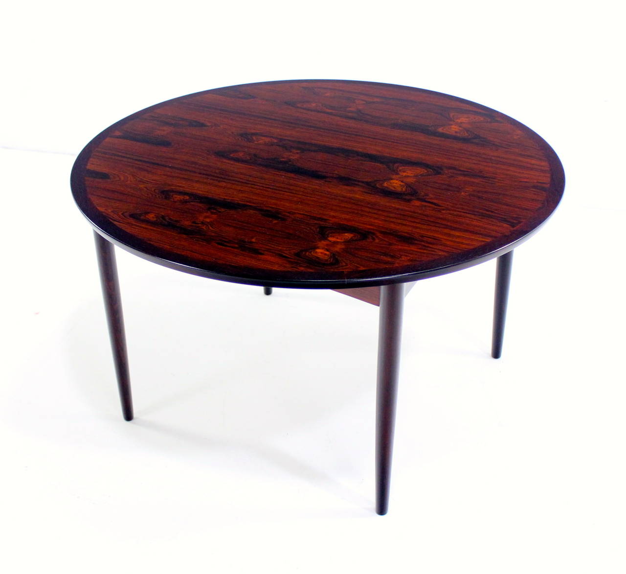 Danish modern cocktail or coffee table.
Mobelintarsia, maker.
Dramatic, richly flame grained rosewood.
Square inset base with tapered, round legs.
Professionally restored and refinished by LookModern.
Matchless quality and price.
Low freight /