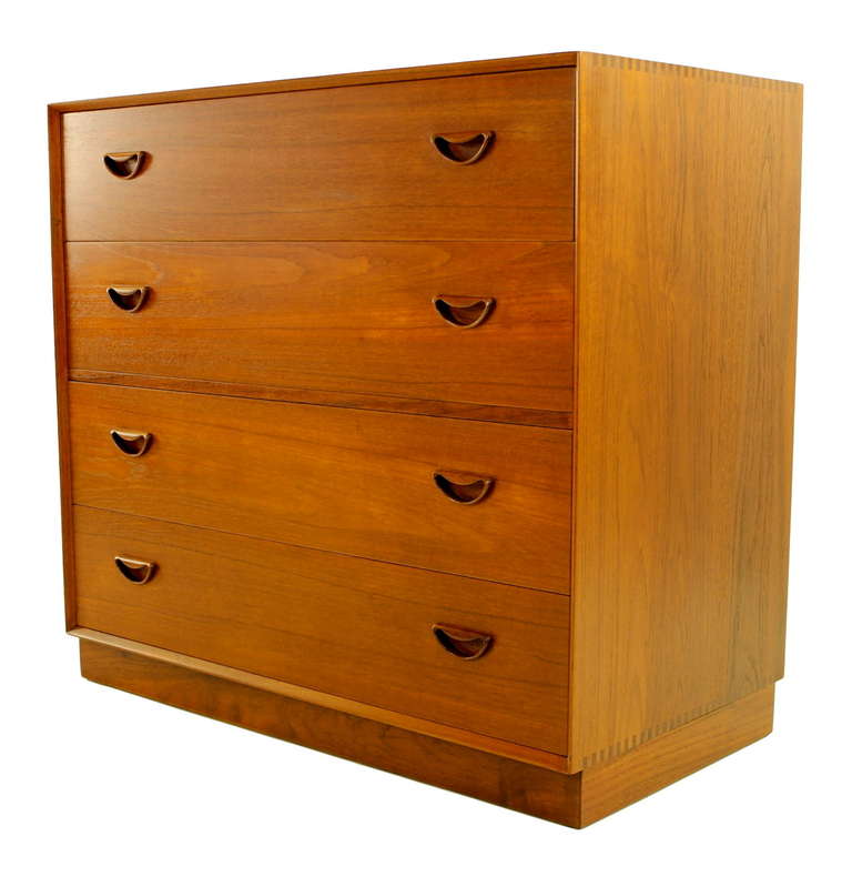 Versatile danish modern cabinet also functions as a desk and/or dresser.
Designed by Peter Hvidt and Orla Molgaard. PD, maker.
Richly grained teak with exquisite signature Hvidt joinery.
Four drawers. Top drawer flips down to reveal six small