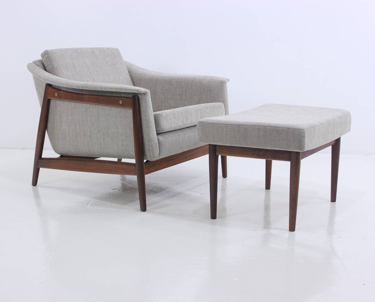 Pair of Danish modern armchairs and ottoman by DUX.
Beautifully formed walnut frames. New foam, newly upholstered in highest quality period fabric.
One ottoman measures: 25.5 W x 17.5