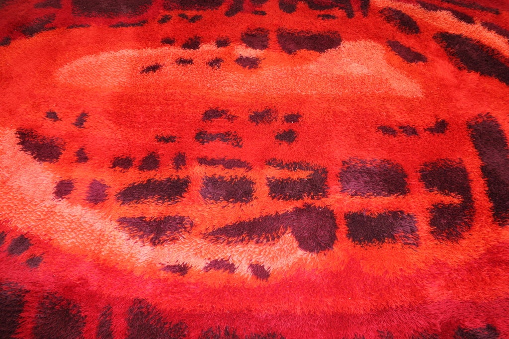 Large Ray rug vibrates with color and form.
Amorphic pattern radiates from coral center, through brilliant reds and oranges to dark, eggplant border.
100% wool.
Matchless quality & price.
Low freight / quick ship.