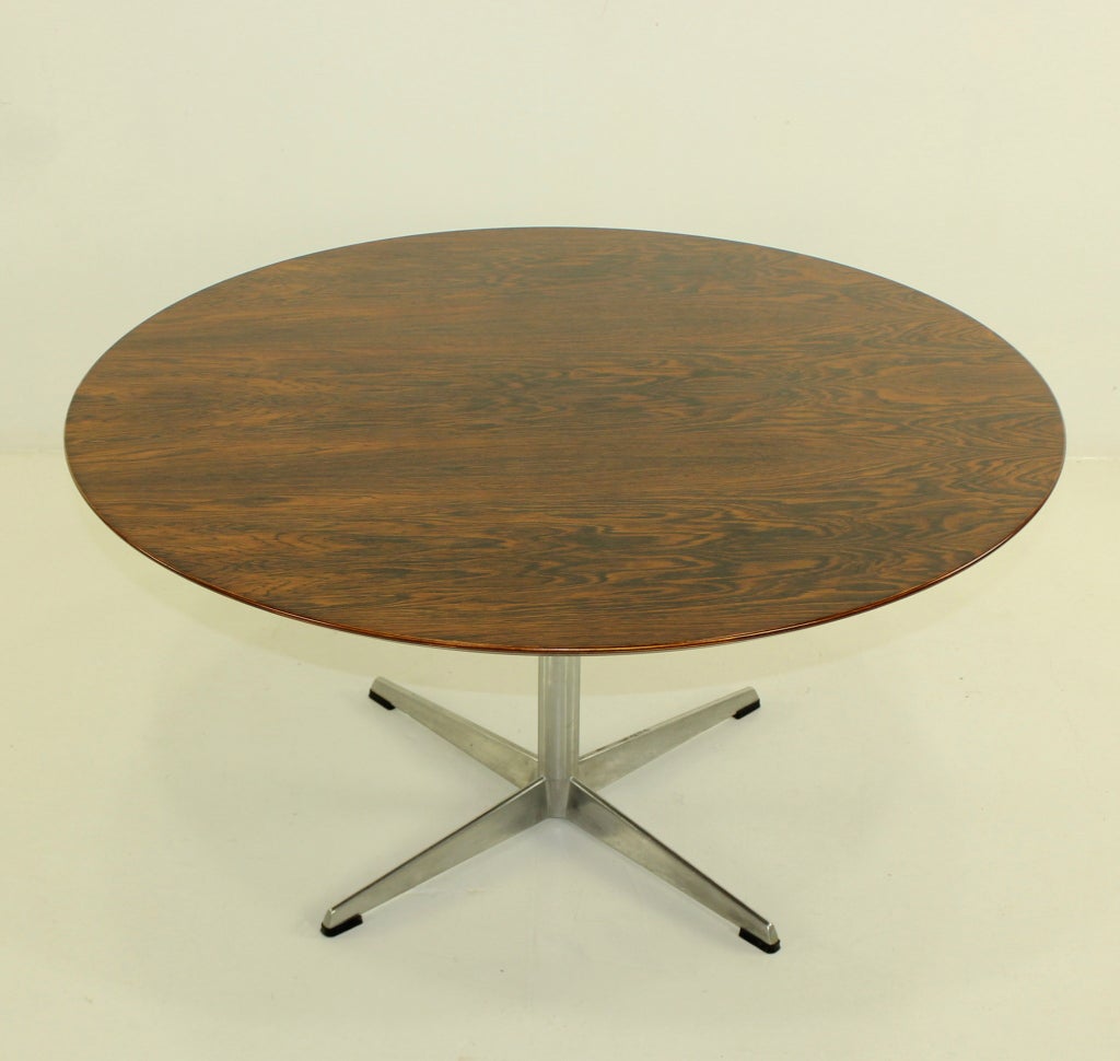 Classic mid-century coffee table by danish master designers Arne Jacobsen & Fritz Hansen.
Richly grained rosewood with aluminum base.

Professionally restored and refinished by LookModern.
Matchless quality and price.
Low freight / quick