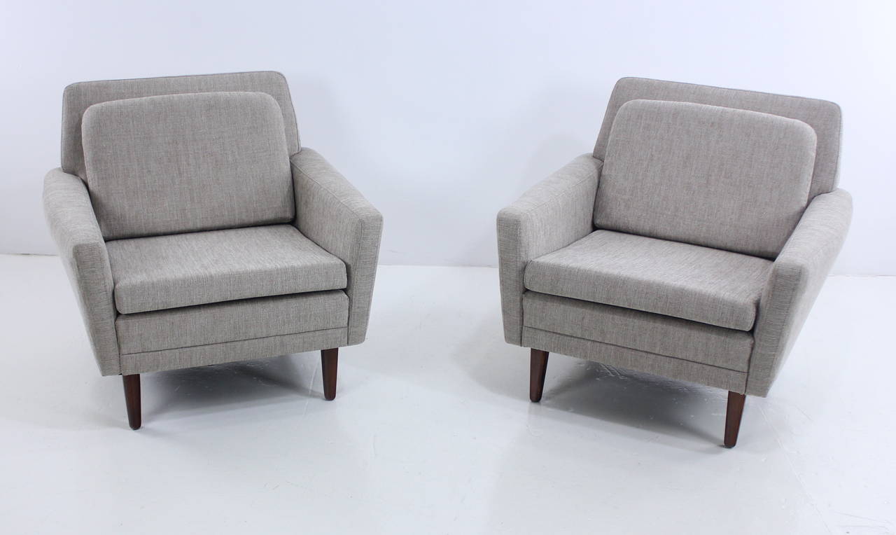 Two Danish modern armchairs designed by Folke Ohlsson.
Perfect examples of modern understated elegance and flair.
DUX, maker.
New foam throughout provides superior comfort.
Impeccably upholstered in highest quality period fabric.
Walnut