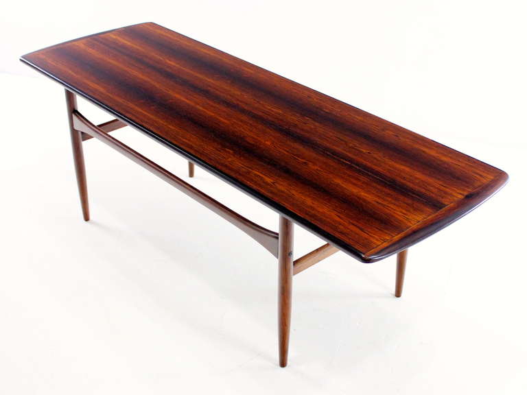 Classic danish modern coffee table designed by Tova and Edvard Kindt-Larsen.
Richly grained rosewood with remarkable style and substance.
Knock down construction for easy shipping.
Professionally restored and refinished by LookModern.
Matchless