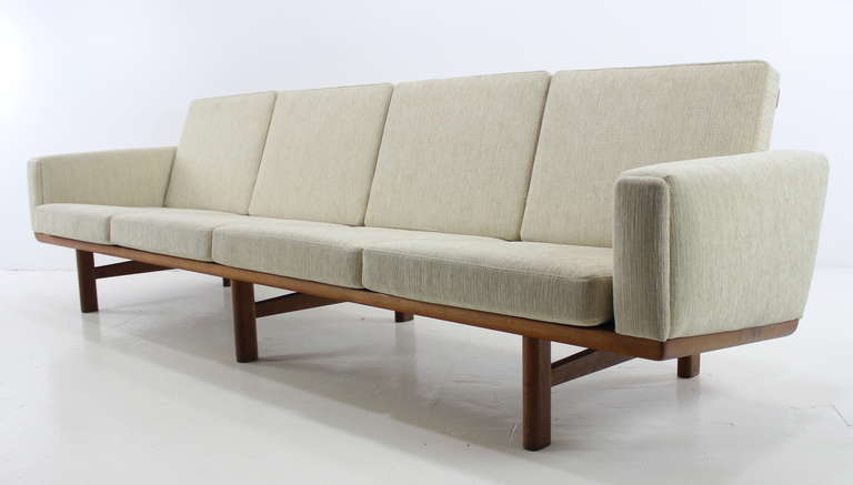 Danish modern sofa, with extraordinary style and elegance, designed in 1955 by Hans Wegner.
Over eight feet wide, it provides ample seating in complete comfort.
Exposed oak frame is breathtaking from every angle.
Impeccably upholstered in highest