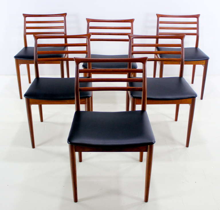 Six danish modern dining chairs designed by Erling Torvitus. Soro Stolefabrik, maker.
Rich teak with subtle asian influences.
Seats newly upholstered in highest quality recycled leather backed vinyl.
Professionally restored and refinished by